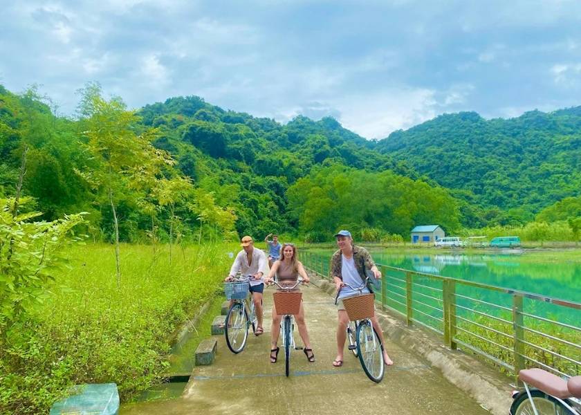 Mountain biking on the coastal road of Cat Ba Island heading towards Viet Hai fishing village.