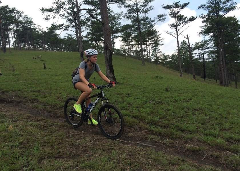 Long distance cyclist riding along the Vietnam central coastline during a 14-day cycling Vietnam North to South tour.