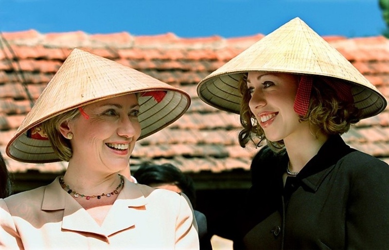 International visitors are wearing conical hats.