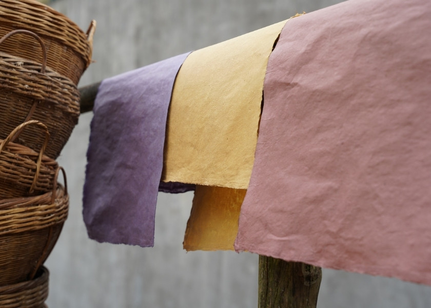 Colorful handmade paper sheets from the Dia Tren paper-making village.
