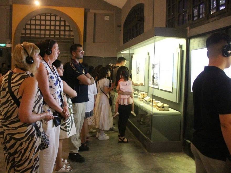 Indoor museum visit in Hanoi during a rainy September afternoon