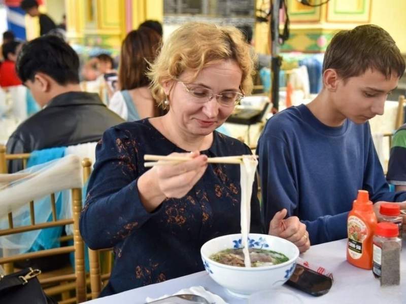 Hanoi morning street scene in October with local food vendors