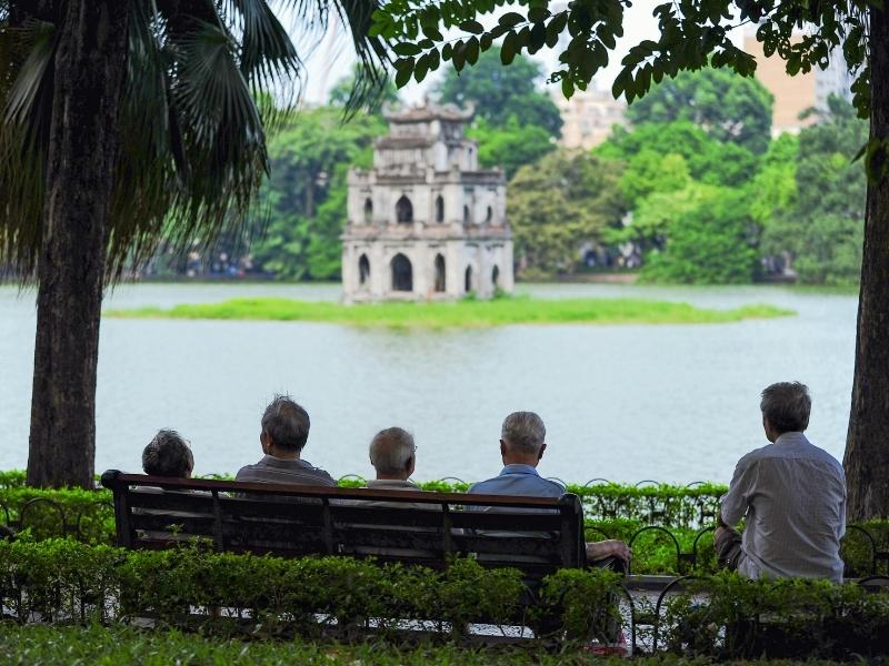 Travelers walking in Hanoi in pleasant October weather