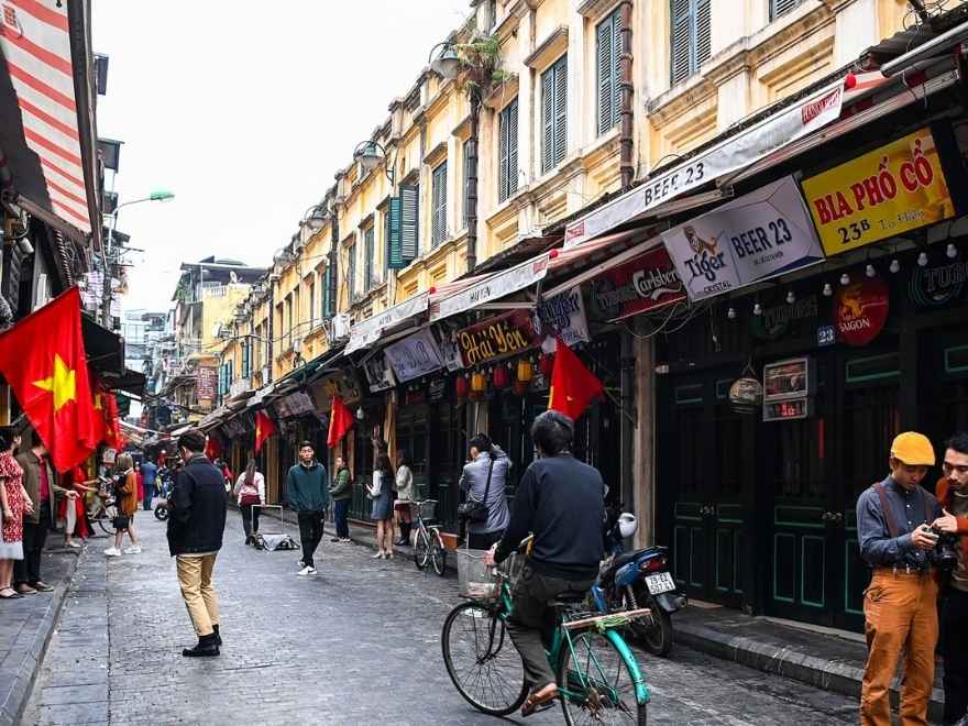 Travelers walking in Hanoi in pleasant September weather