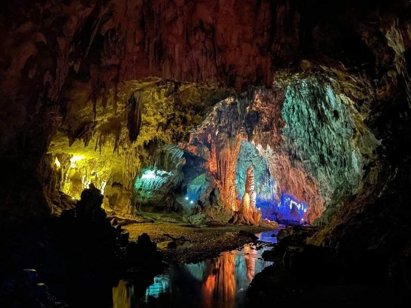 Layered limestone formations and terraced cave floor inside Nguom Ngao Cave.