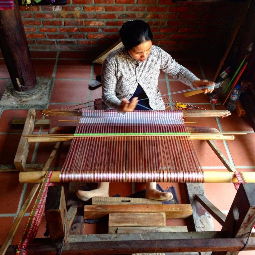 Artisans weaving silk in Hoi An