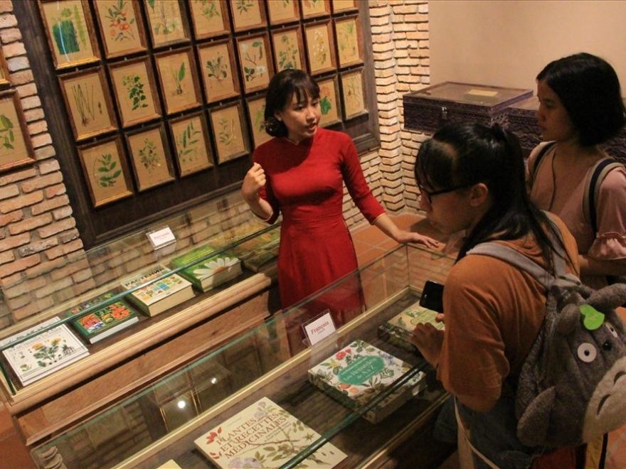 A gallery displaying books and documents on traditional medicine.