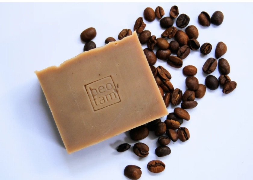 Square bar of light brown organic coffee soap with a logo in Buon Ma Thuot, Vietnam.