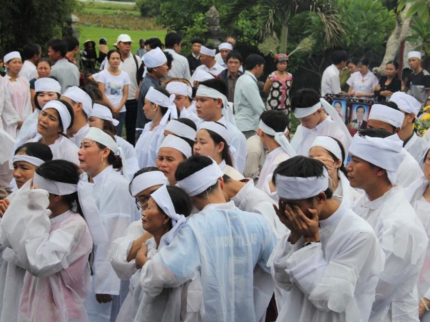 White mourning headband worn by a close relative at a Vietnamese funeral