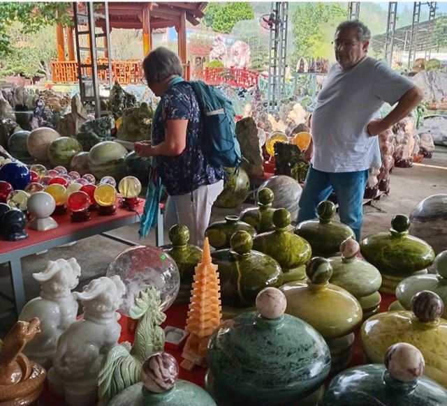 They also admire intricate ceramic sculptures and colorful handmade crafts.