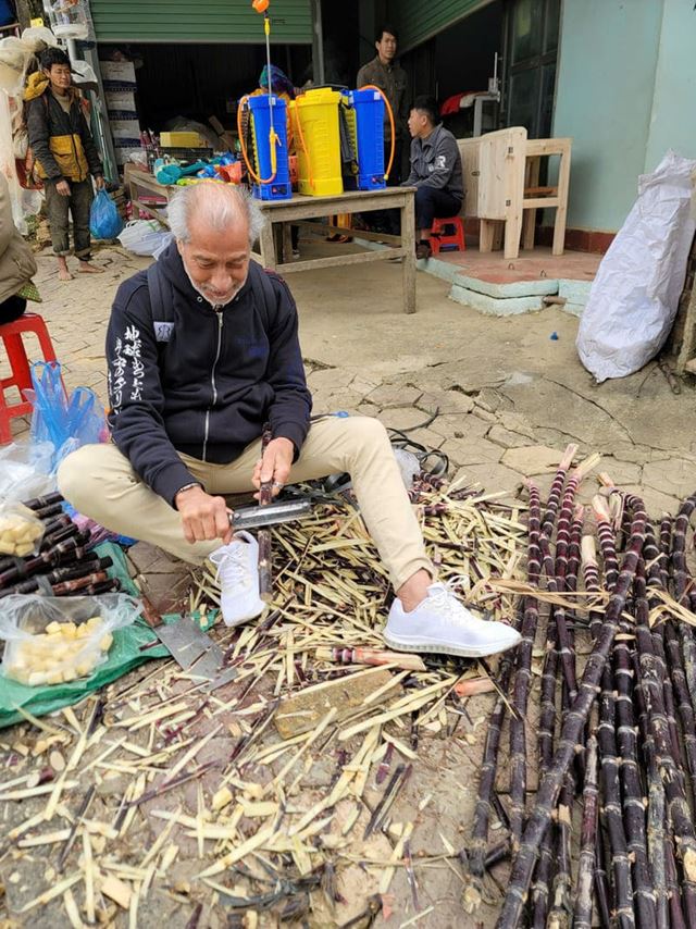 Alex trying his hand at preparing fresh sugarcane.