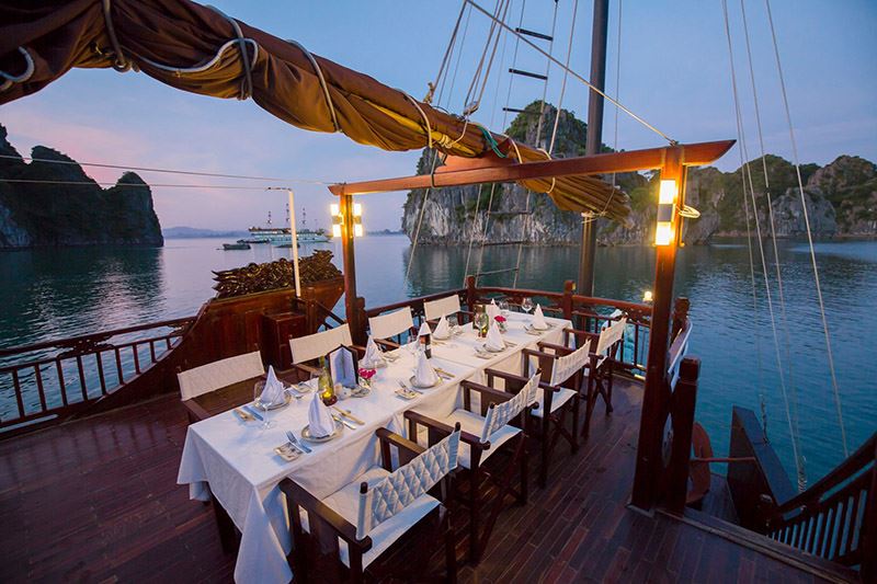 A restaurant on the upper deck of a junk boat in Halong Bay.